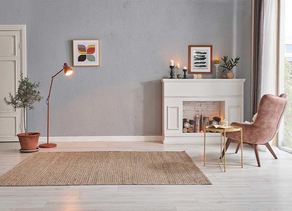 Modern room concept interior style, chair fireplace frame wicker carpet decoration, grey stone wall background.